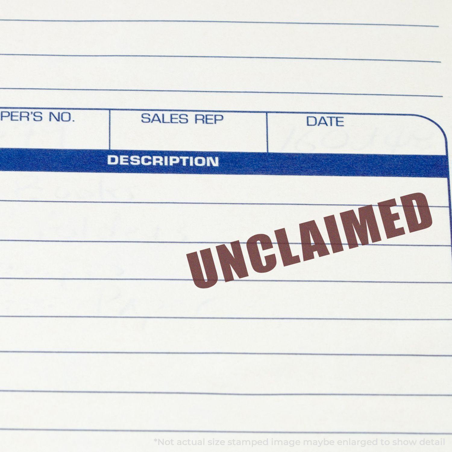 Large Pre-Inked Unclaimed Stamp marking a document with the word UNCLAIMED in bold red letters on a form.