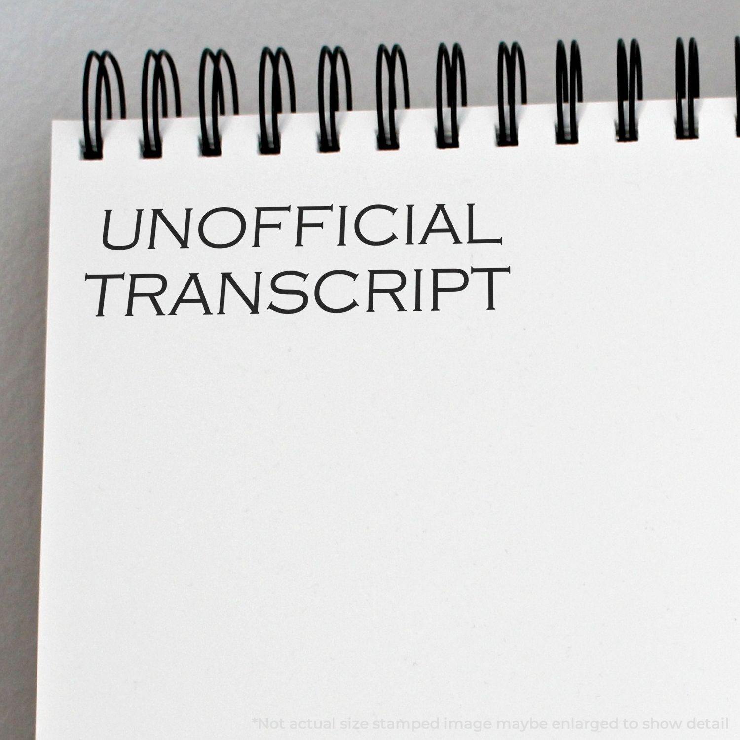 Slim Pre-Inked Unofficial Transcript Stamp used on a white notepad, displaying the text UNOFFICIAL TRANSCRIPT in black ink.