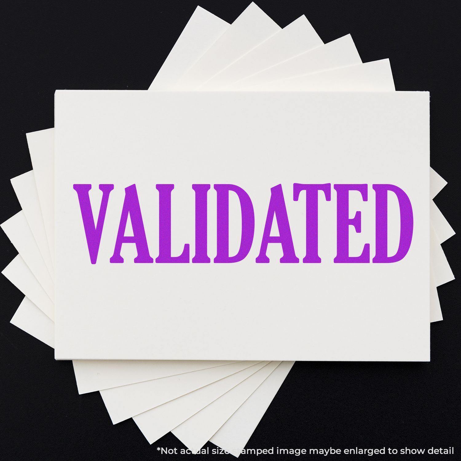 Large Self Inking Validated Stamp in purple ink on white paper, with multiple sheets fanned out underneath.