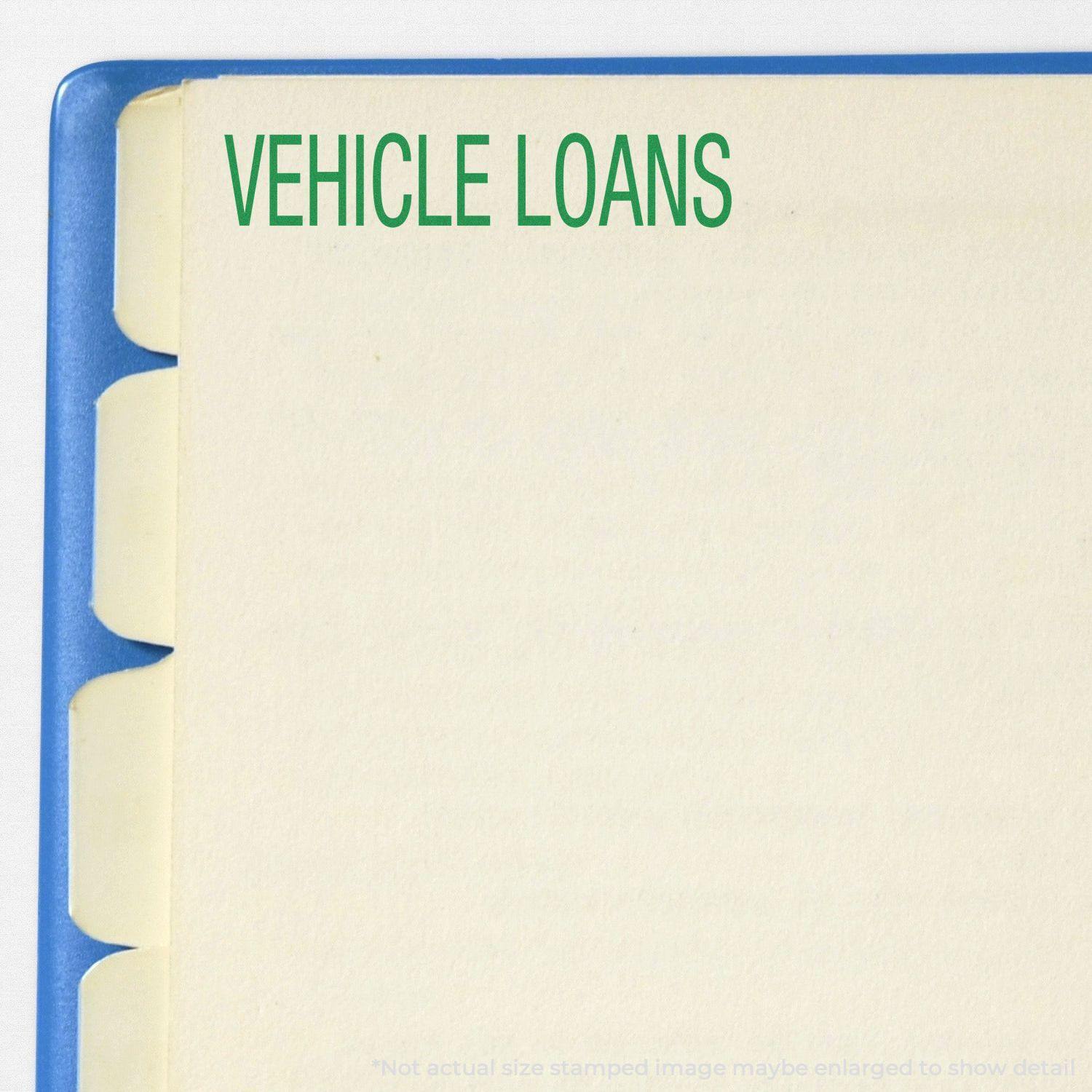 Large Pre-Inked Vehicle Loans Stamp used on a file folder with the text 'VEHICLE LOANS' stamped in green on a tabbed divider.