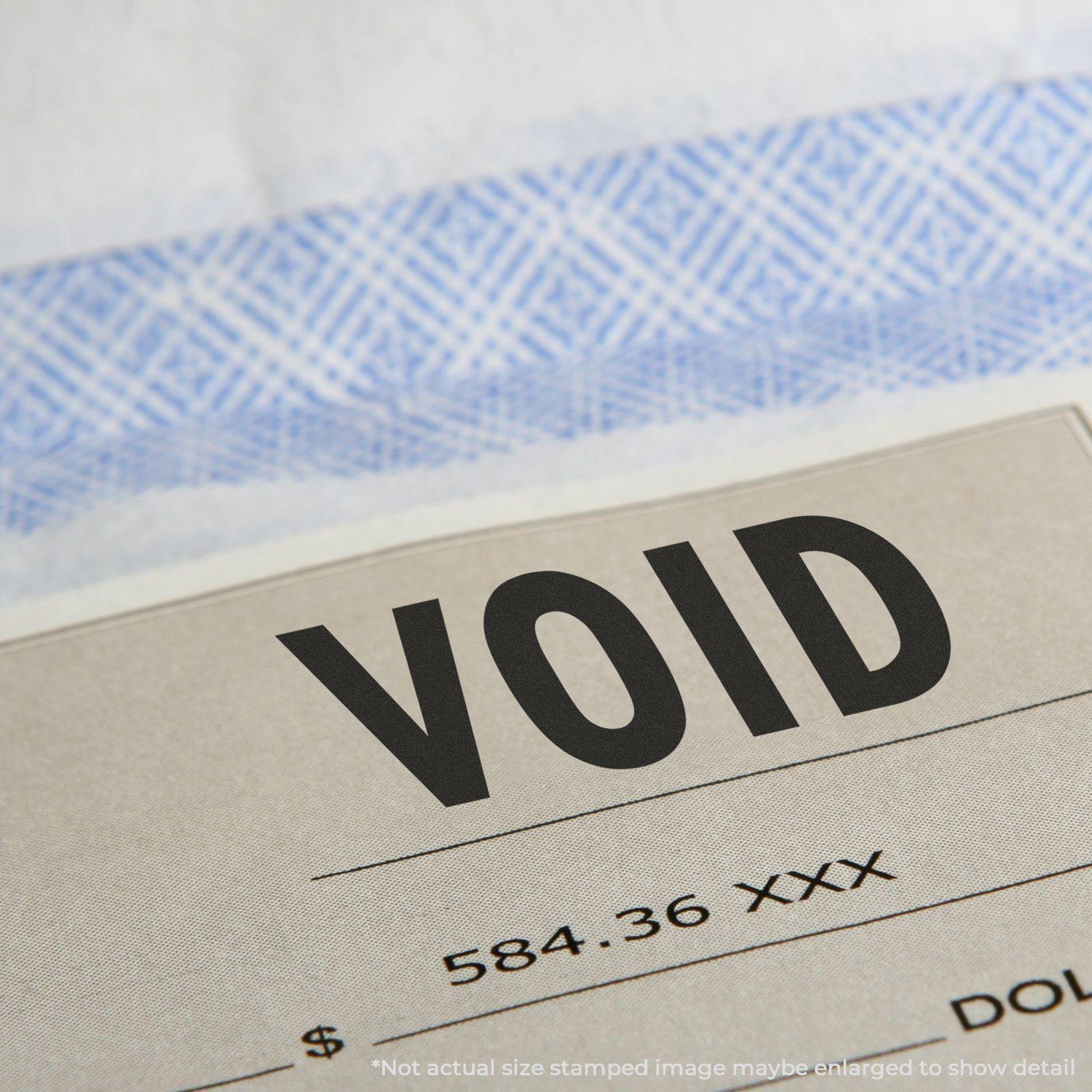 Close-up of a document stamped with "VOID" using the Slim Pre-Inked Void Stamp, showing clear and bold text.