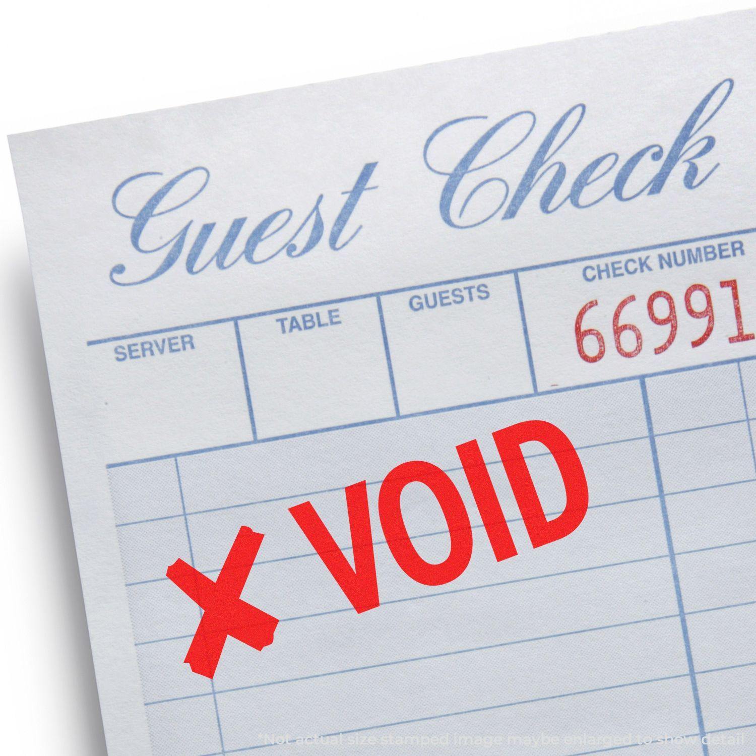 Guest check stamped with Large Self Inking Void with X Stamp in red ink, indicating the check is voided.