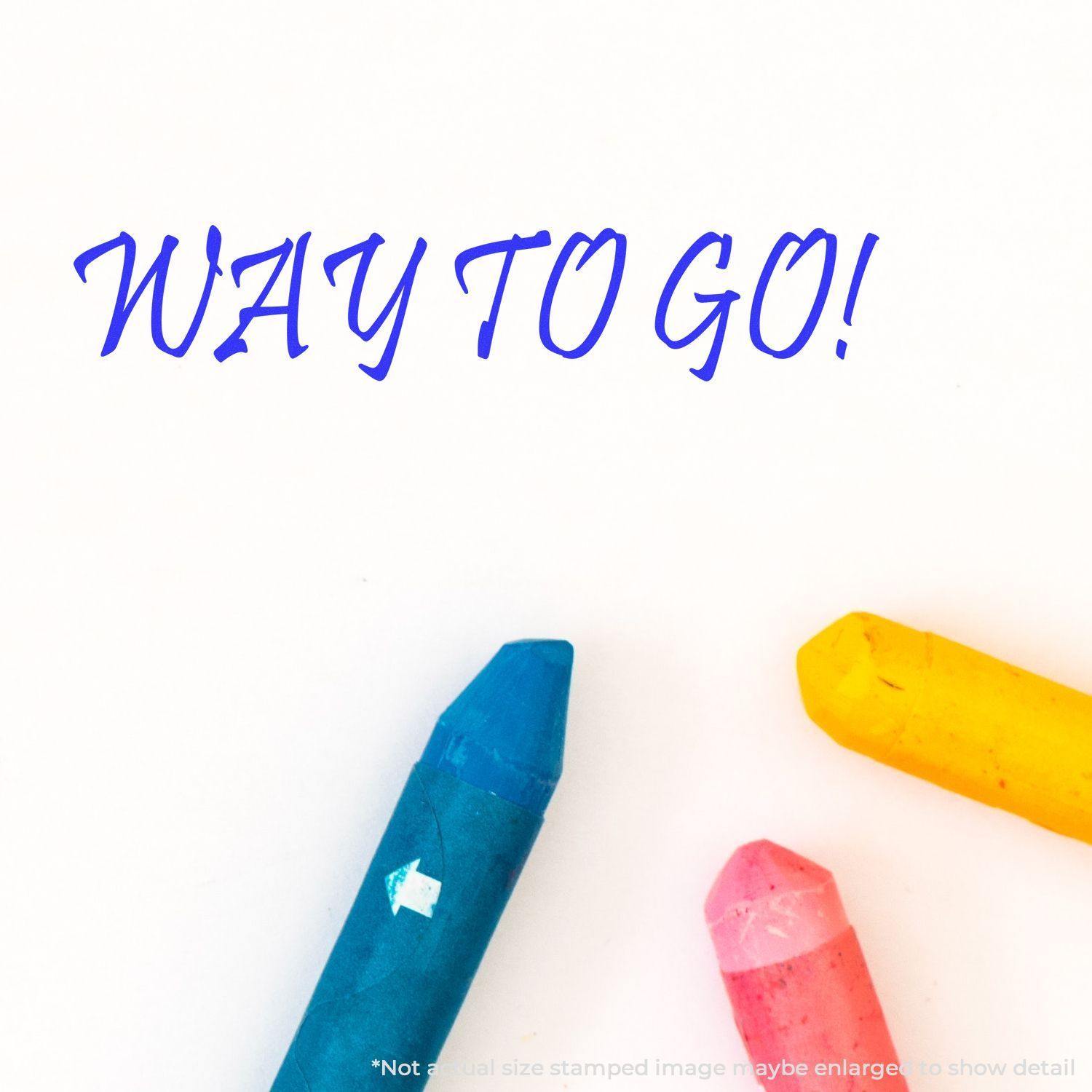 Way To Go Rubber Stamp in blue ink on white paper with colorful crayons in the corner.