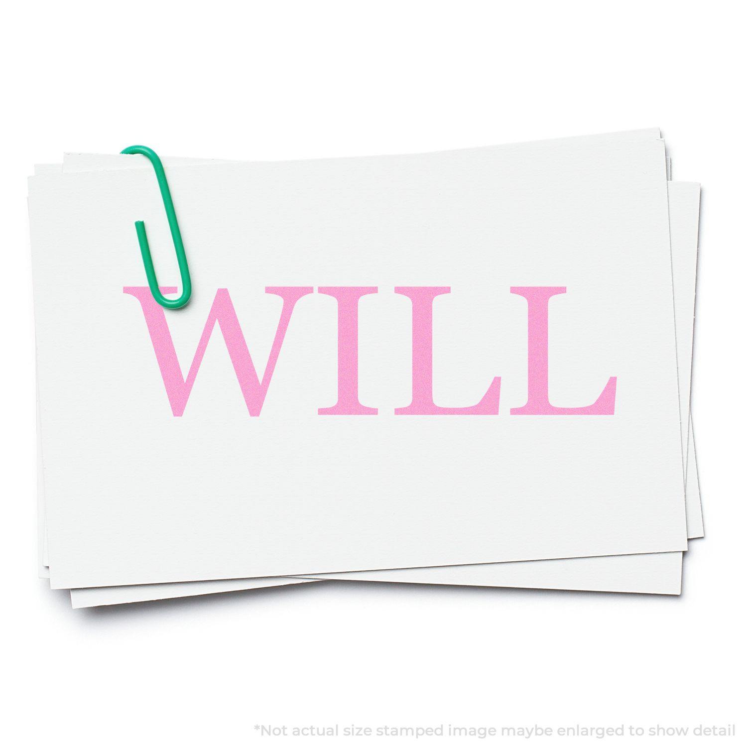 A stack of white papers with WILL stamped in pink using the Large Self Inking Will Stamp, held together by a green paperclip.