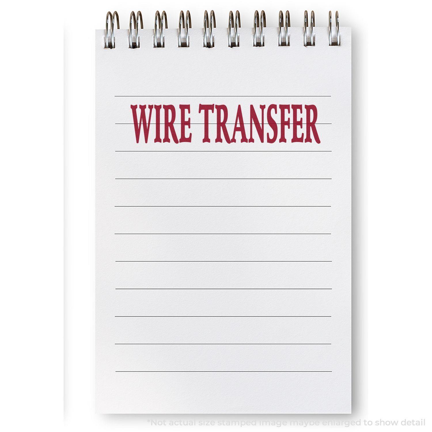 A notebook with lined pages and a red WIRE TRANSFER stamp at the top, created using a large wire transfer rubber stamp.