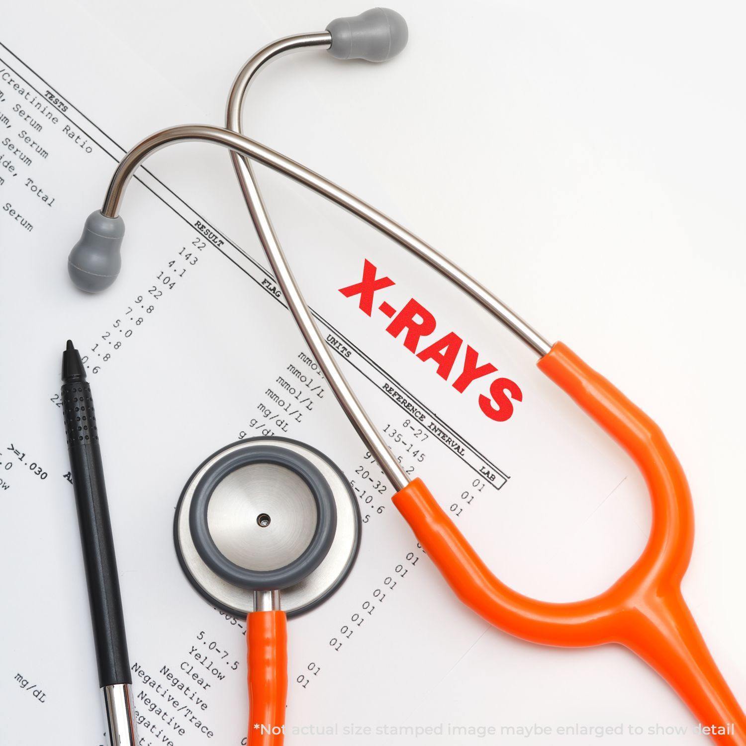 A stethoscope and pen lie on a medical document stamped with X-RAYS using the Self Inking X-Rays Stamp.