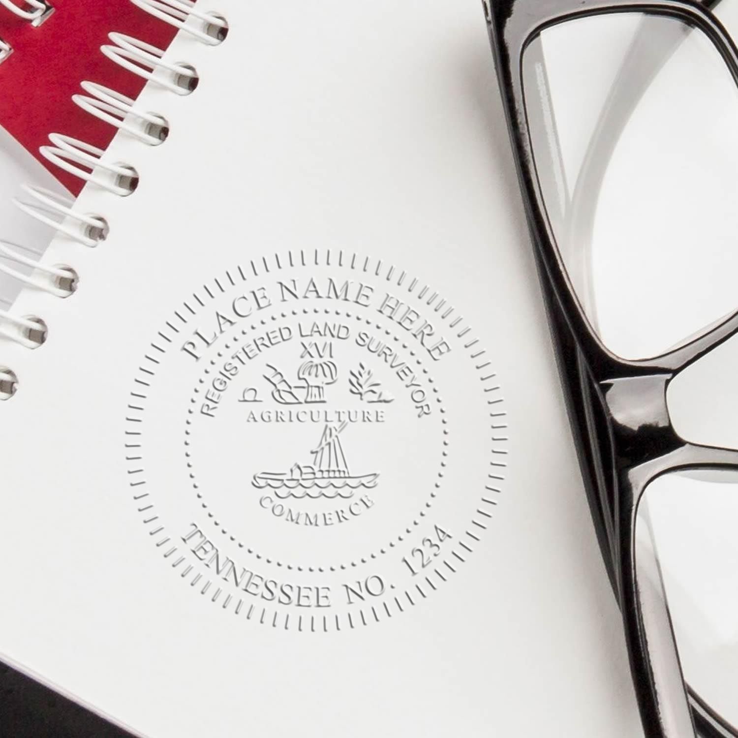 An in use photo of the Hybrid Tennessee Land Surveyor Seal showing a sample imprint on a cardstock