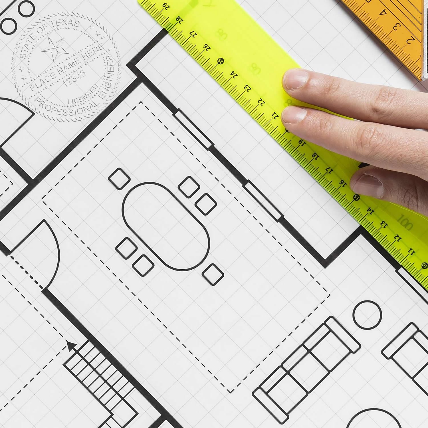 A hand using a yellow ruler on a blueprint with a Professional Engineer Chrome Gift Seal Embosser imprint visible on the paper.