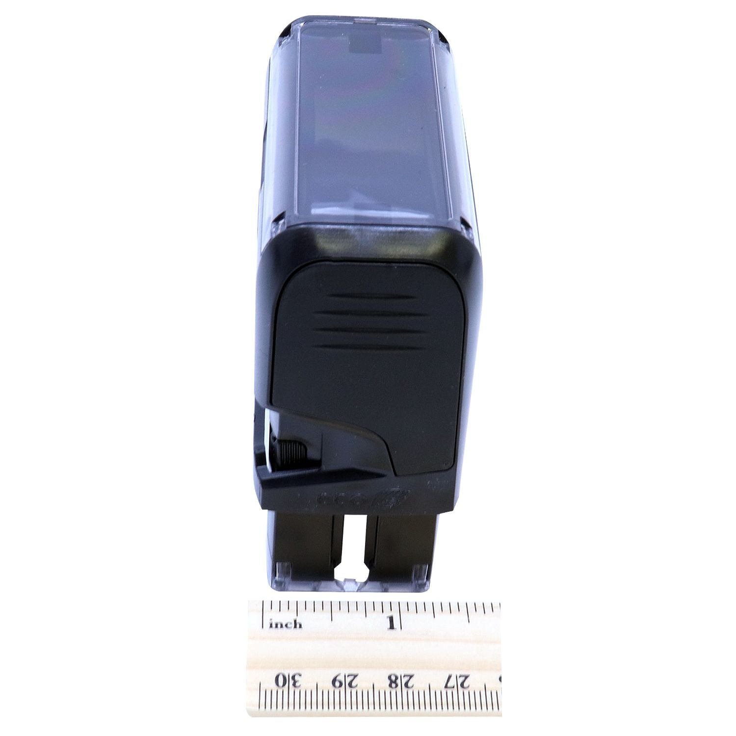 Custom Self Inking Stamp Trodat 4913 Size 7/8 x 2-3/8, black, shown from an angled side view with a ruler for scale.