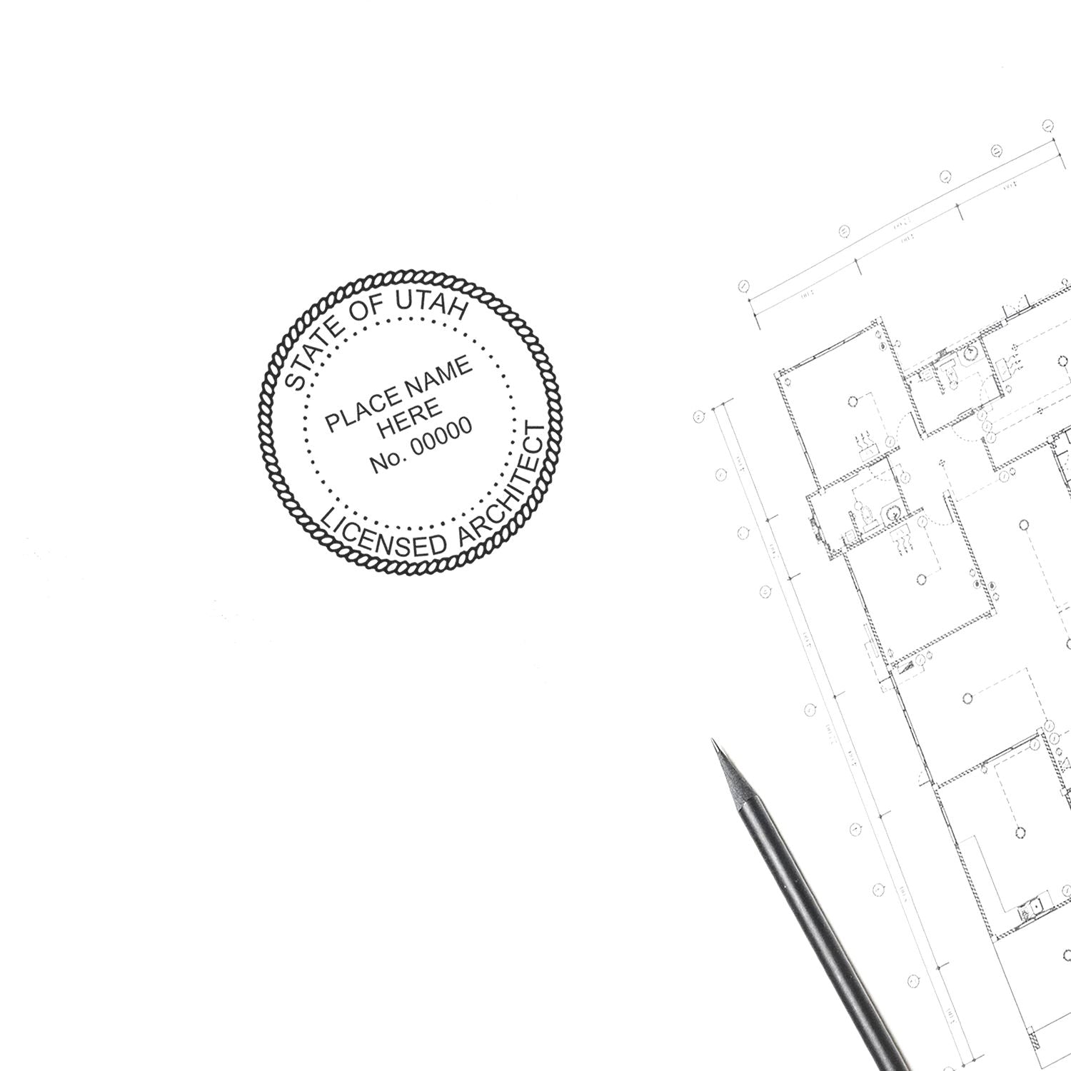 Self Inking Utah Architect Stamp in use on architectural plans, with a pen nearby.