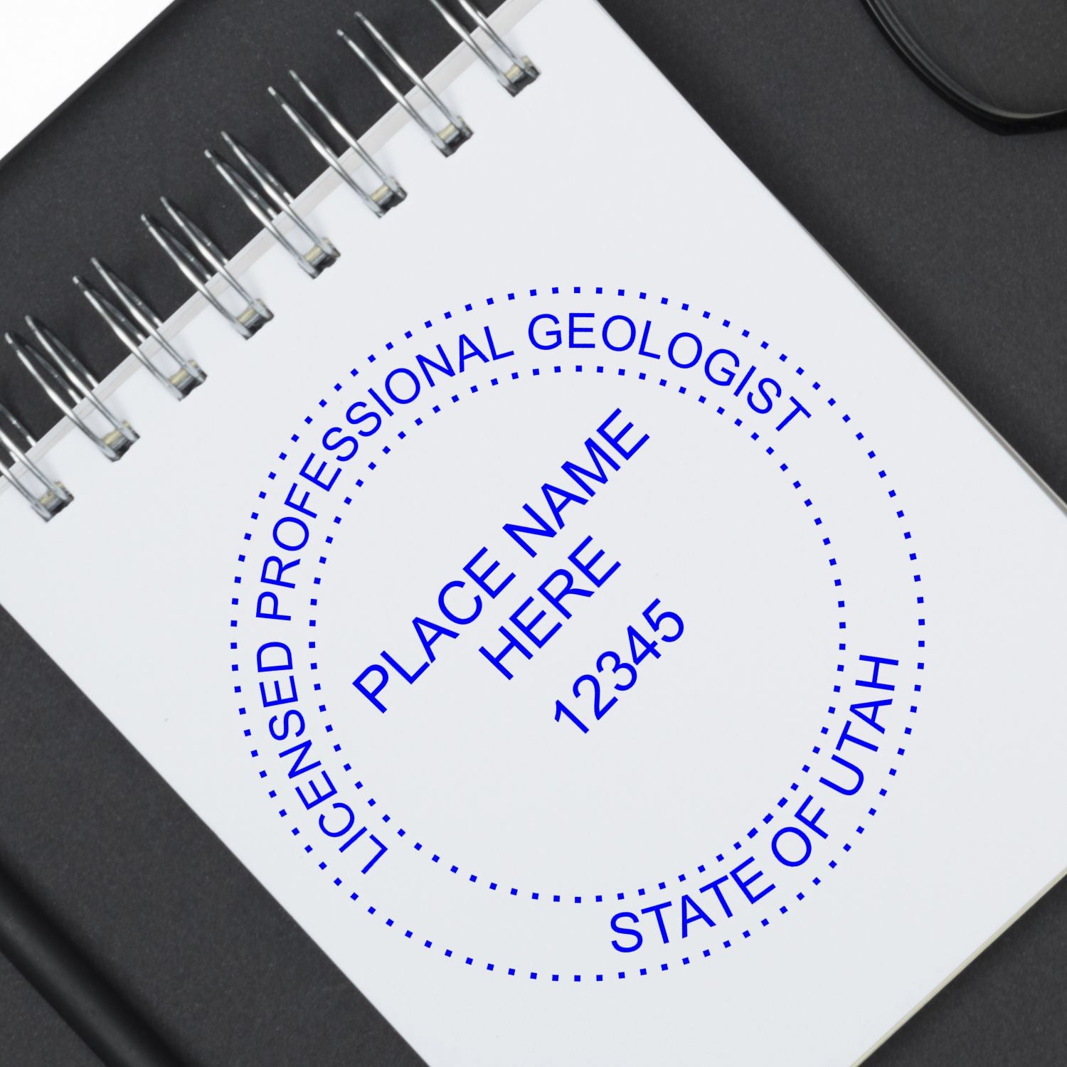 A lifestyle photo showing a stamped image of the Digital Utah Geologist Stamp, Electronic Seal for Utah Geologist on a piece of paper