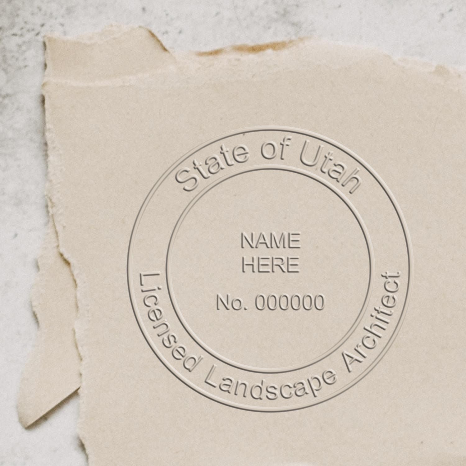 A stamped impression of the State of Utah Handheld Landscape Architect Seal in this stylish lifestyle photo, setting the tone for a unique and personalized product.