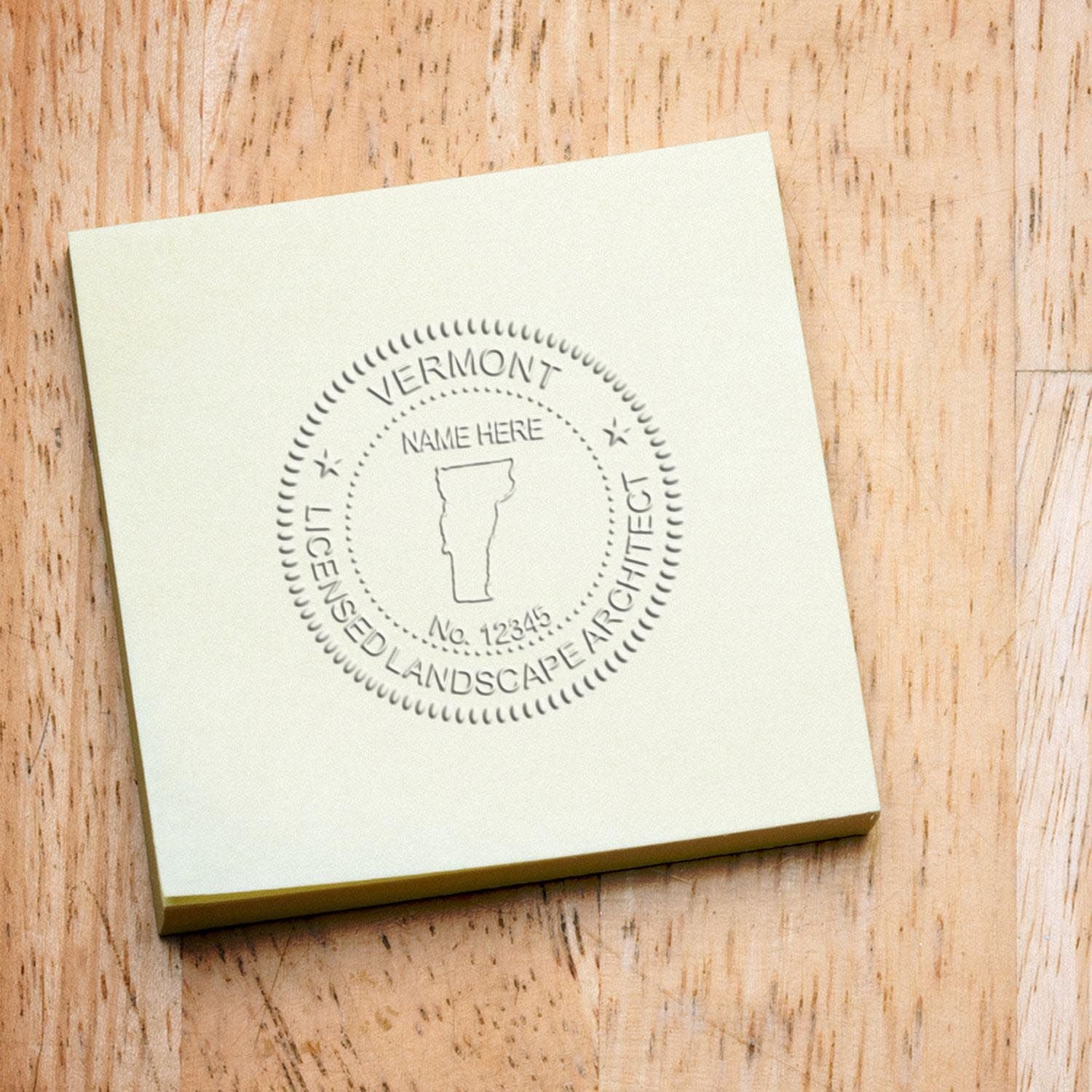 The State of Vermont Handheld Landscape Architect Seal stamp impression comes to life with a crisp, detailed photo on paper - showcasing true professional quality.