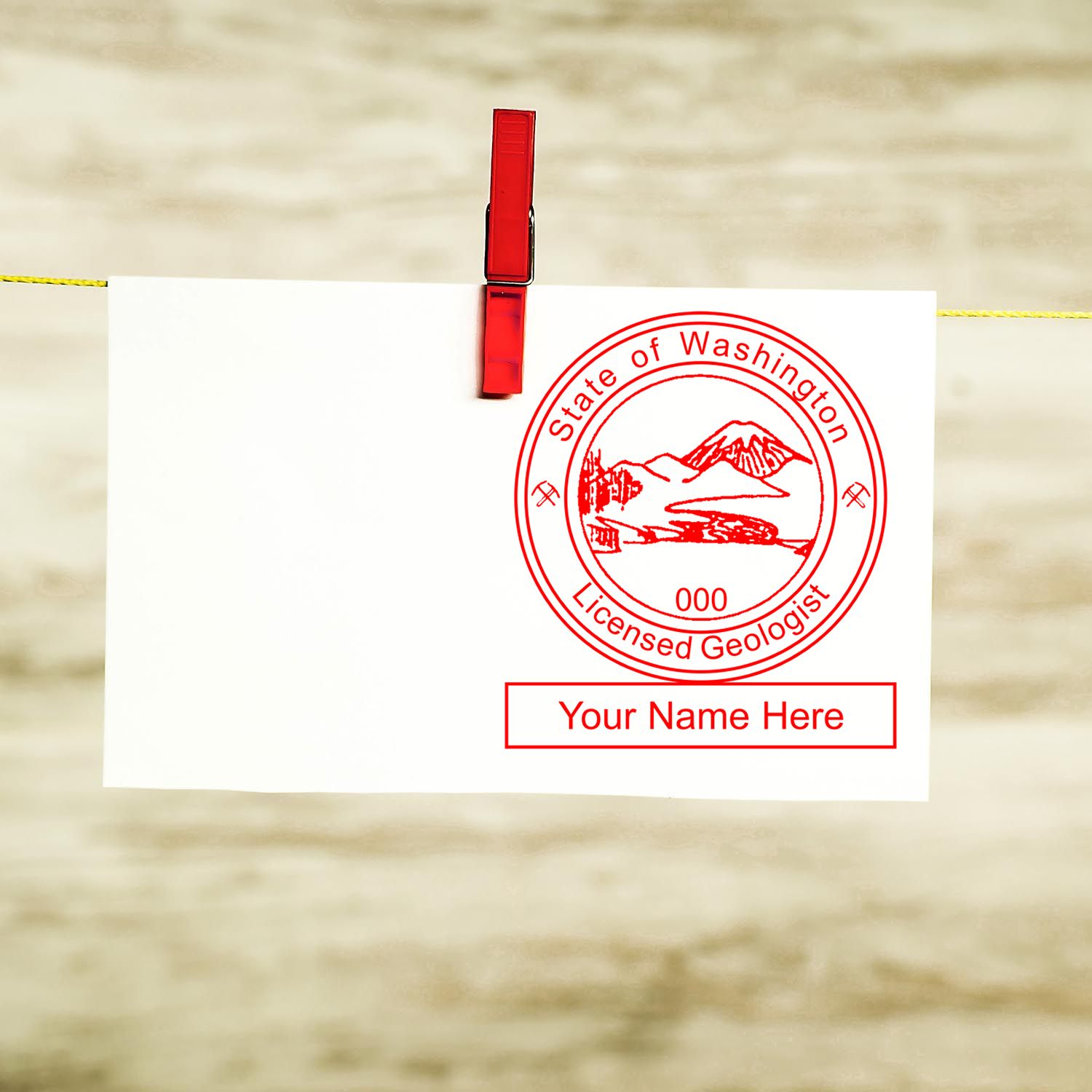 A stamped imprint of the Slim Pre-Inked Washington Professional Geologist Seal Stamp in this stylish lifestyle photo, setting the tone for a unique and personalized product.