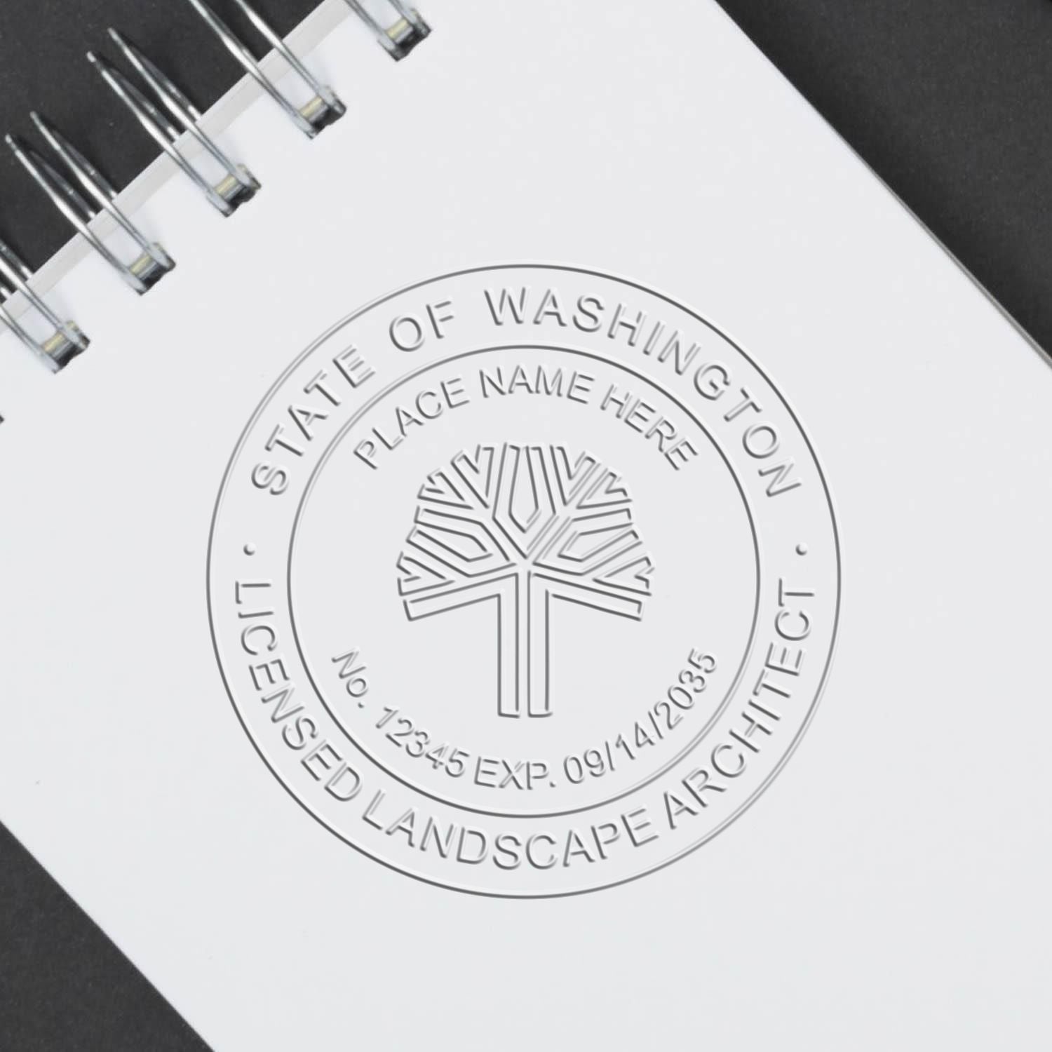 A stamped impression of the State of Washington Handheld Landscape Architect Seal in this stylish lifestyle photo, setting the tone for a unique and personalized product.