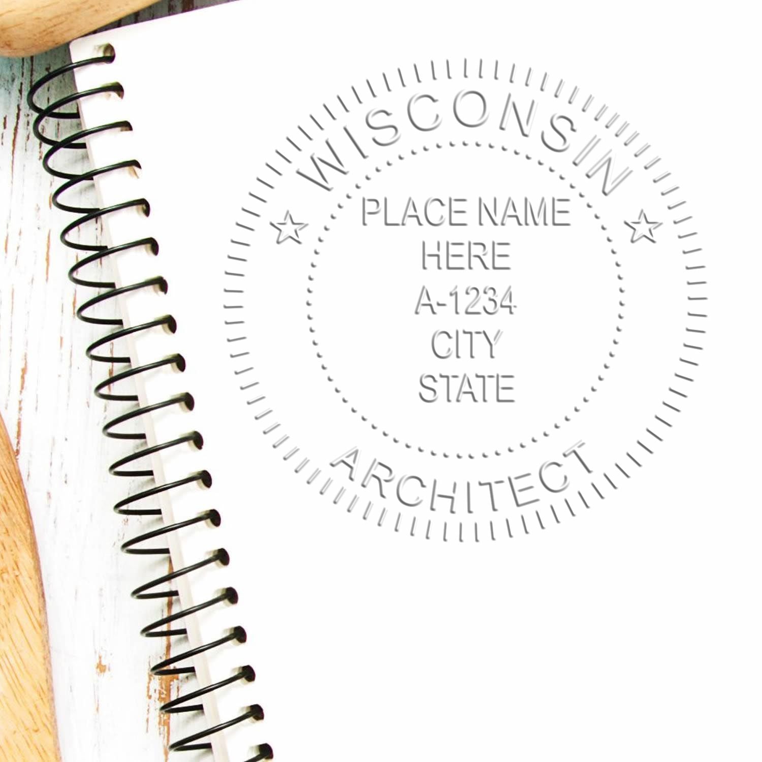 A lifestyle photo showing a stamped image of the Handheld Wisconsin Architect Seal Embosser on a piece of paper