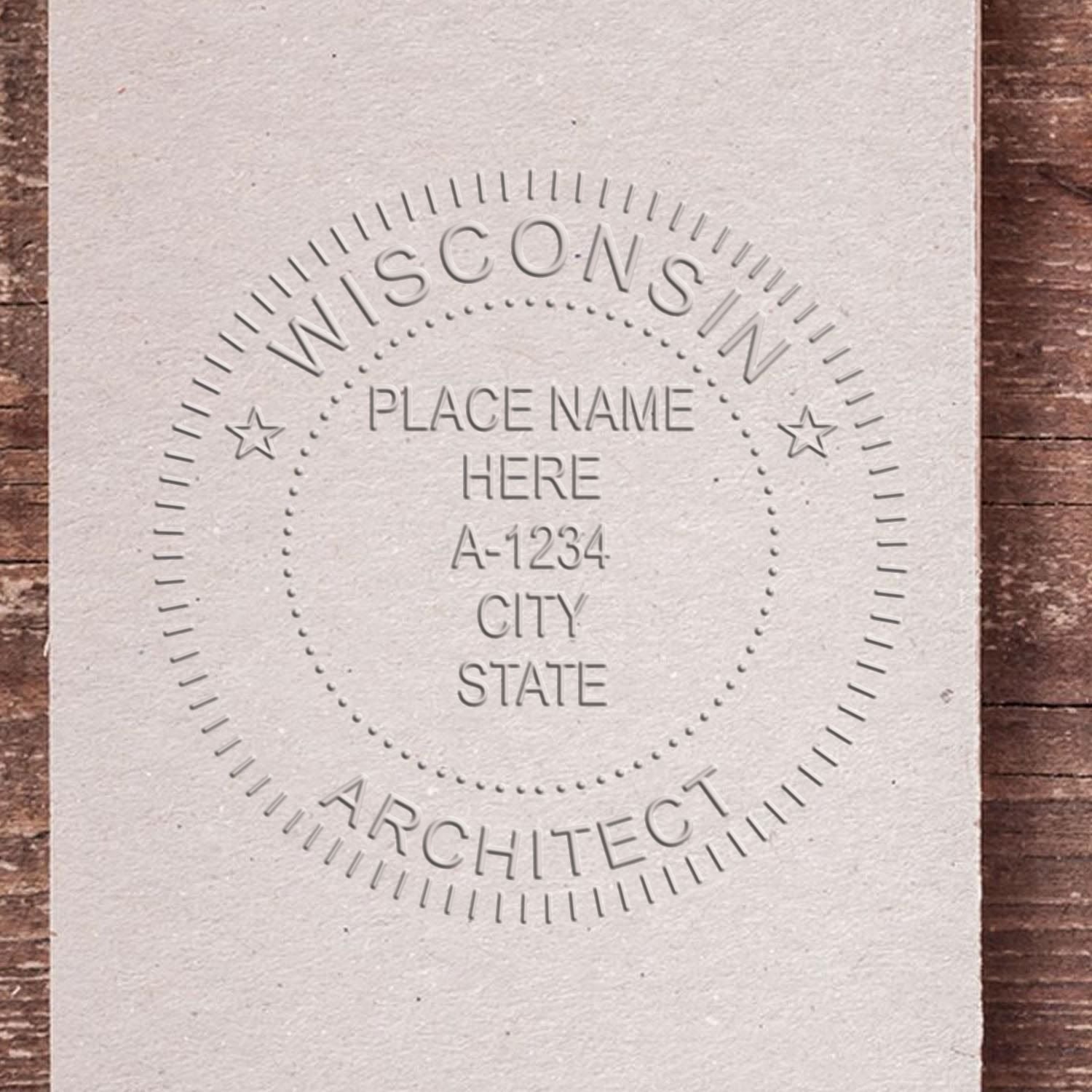 A lifestyle photo showing a stamped image of the Wisconsin Desk Architect Embossing Seal on a piece of paper