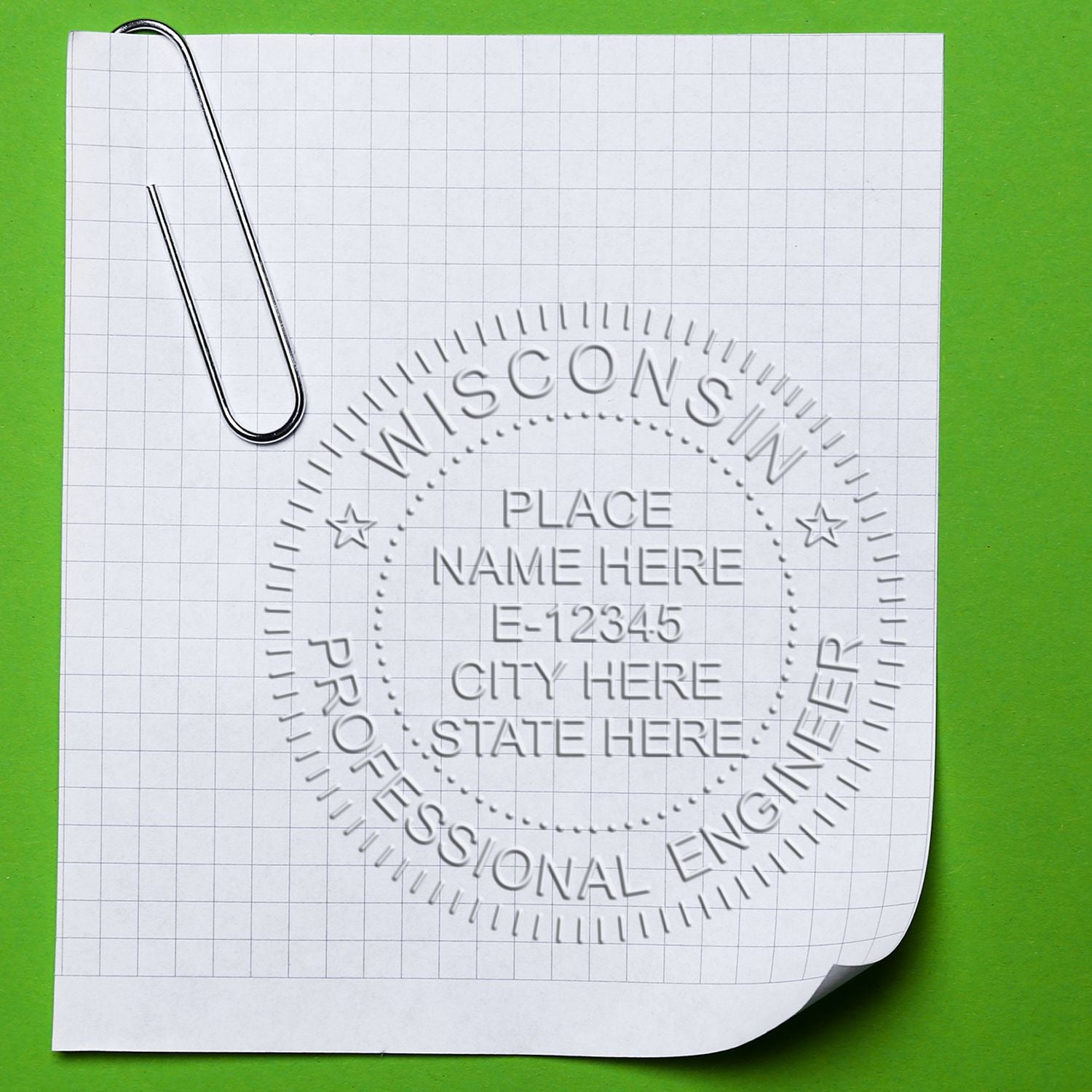 An in use photo of the Gift Wisconsin Engineer Seal showing a sample imprint on a cardstock