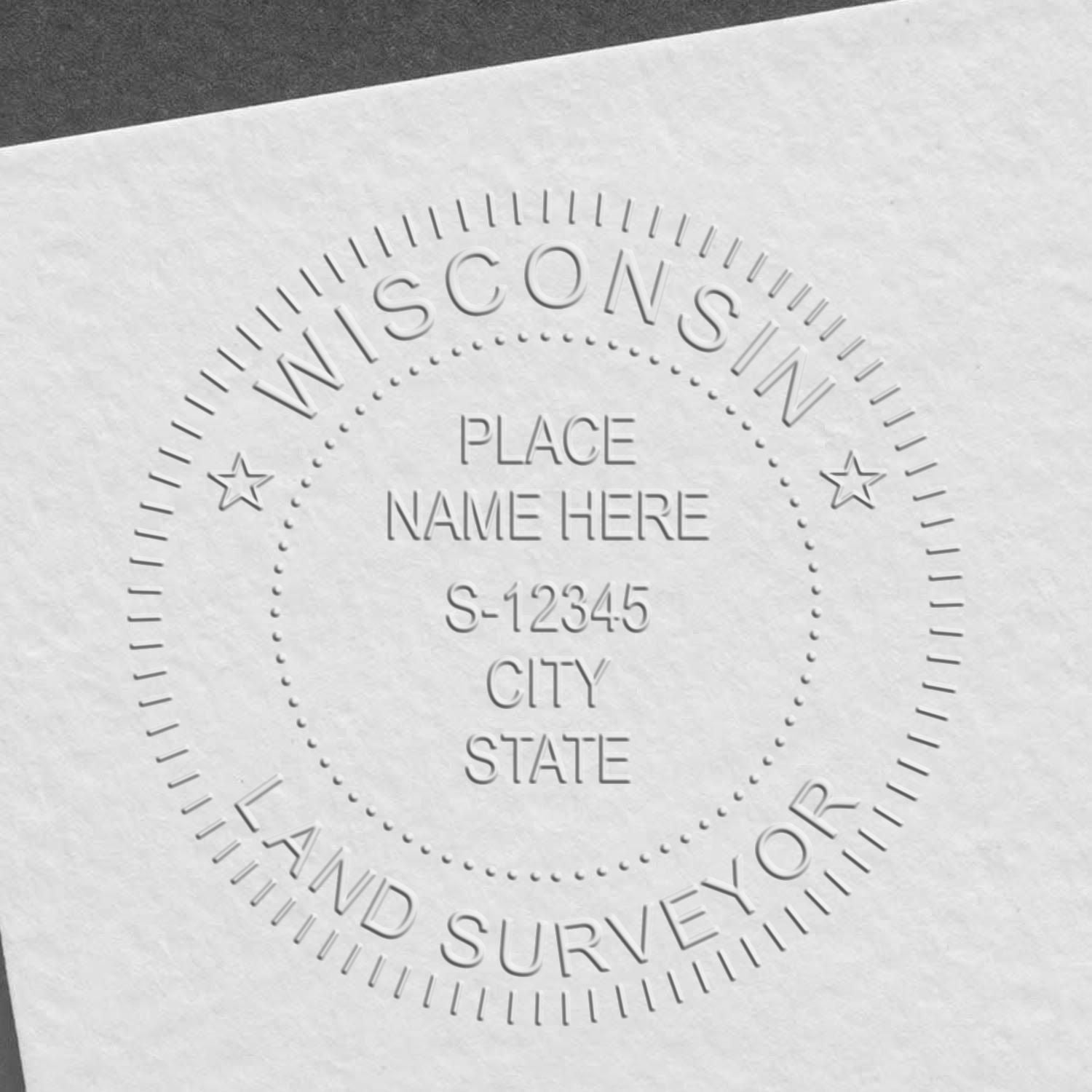 An in use photo of the Hybrid Wisconsin Land Surveyor Seal showing a sample imprint on a cardstock