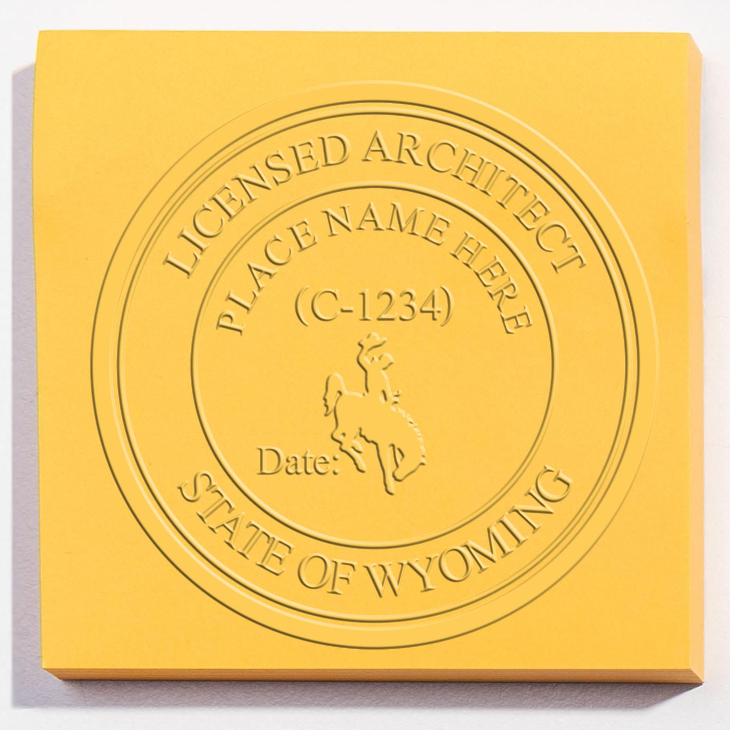 Extended Long Reach Wyoming Architect Seal Embosser in use photo showing a stamped imprint of the Extended Long Reach Wyoming Architect Seal Embosser