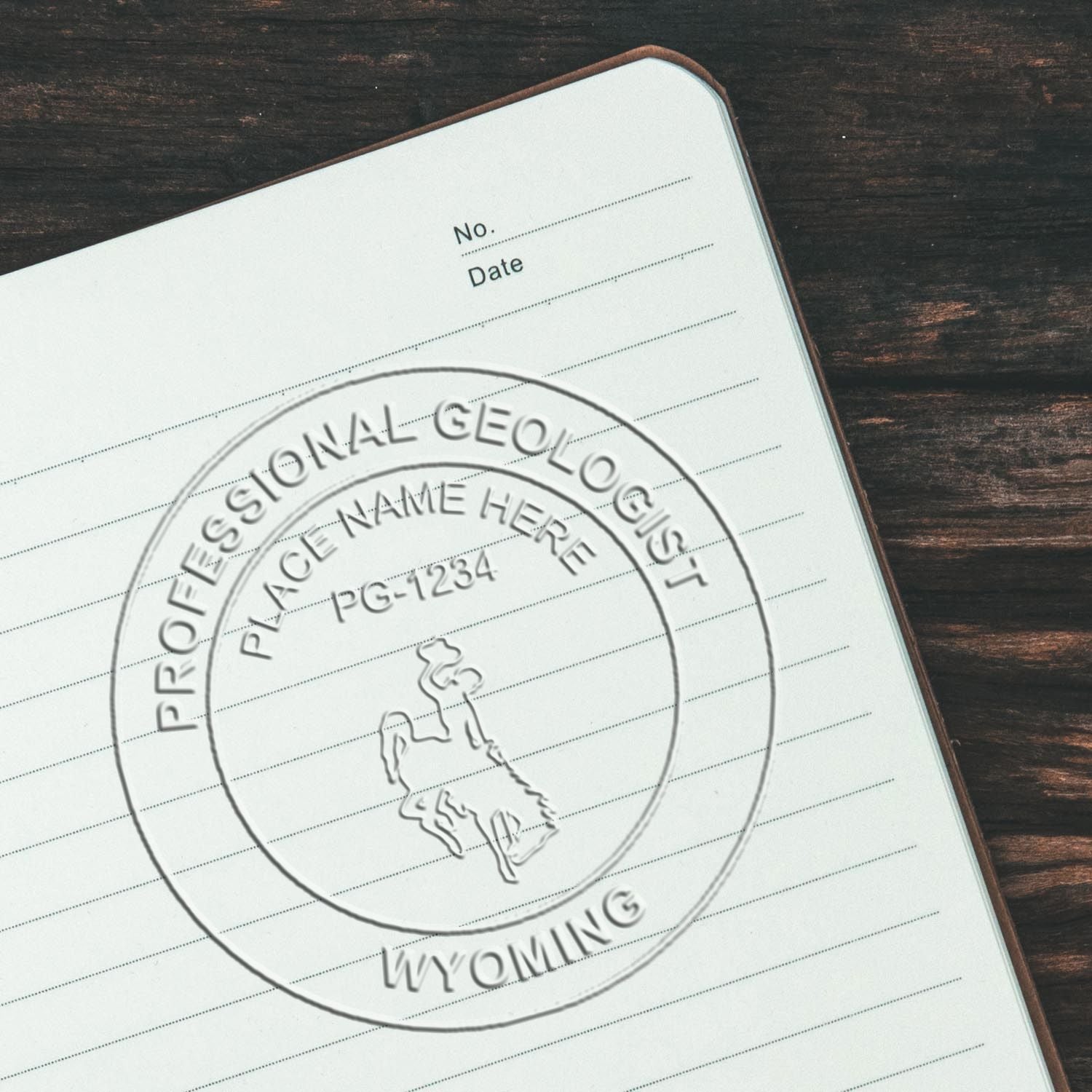 An in use photo of the Wyoming Geologist Desk Seal showing a sample imprint on a cardstock