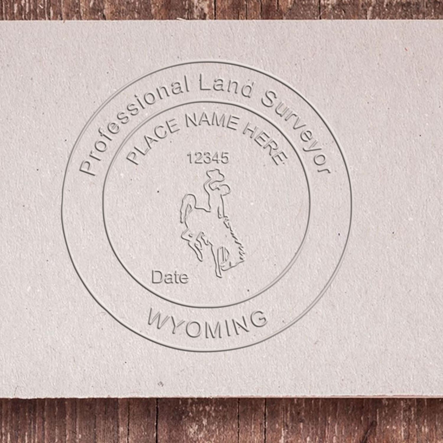 A stamped impression of the Extended Long Reach Wyoming Surveyor Embosser in this stylish lifestyle photo, setting the tone for a unique and personalized product.