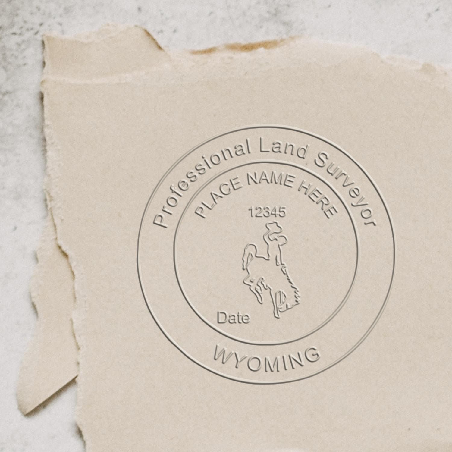 The Gift Wyoming Land Surveyor Seal stamp impression comes to life with a crisp, detailed image stamped on paper - showcasing true professional quality.