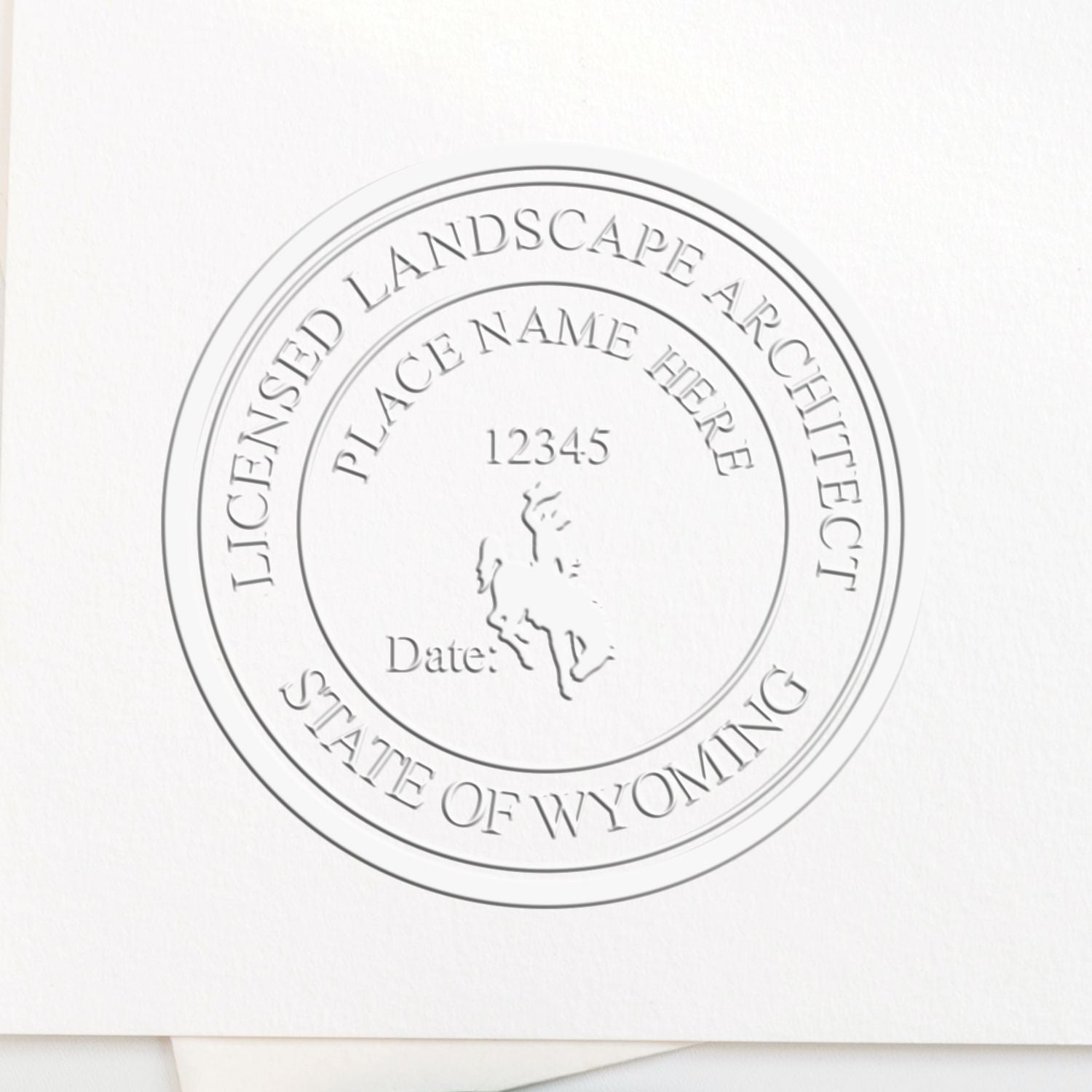 A stamped impression of the State of Wyoming Handheld Landscape Architect Seal in this stylish lifestyle photo, setting the tone for a unique and personalized product.