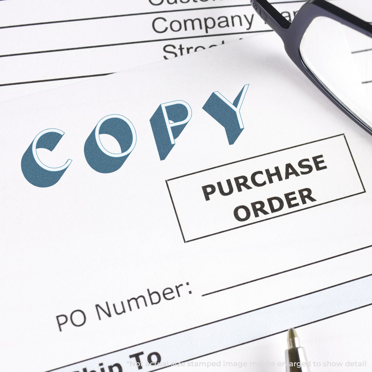 Slim Stamp 1444 Customized Pre-Inked Stamp 1/2 x 1-3/4 used to mark COPY on a purchase order document, with glasses and pen nearby.