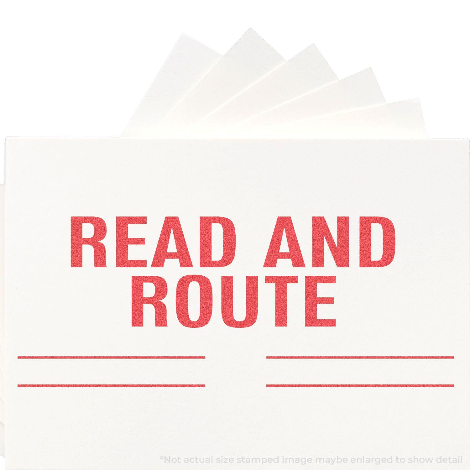 Jumbo Read And Route Xstamper Stamp in use, displaying bold red text READ AND ROUTE on white paper with lines for additional notes.