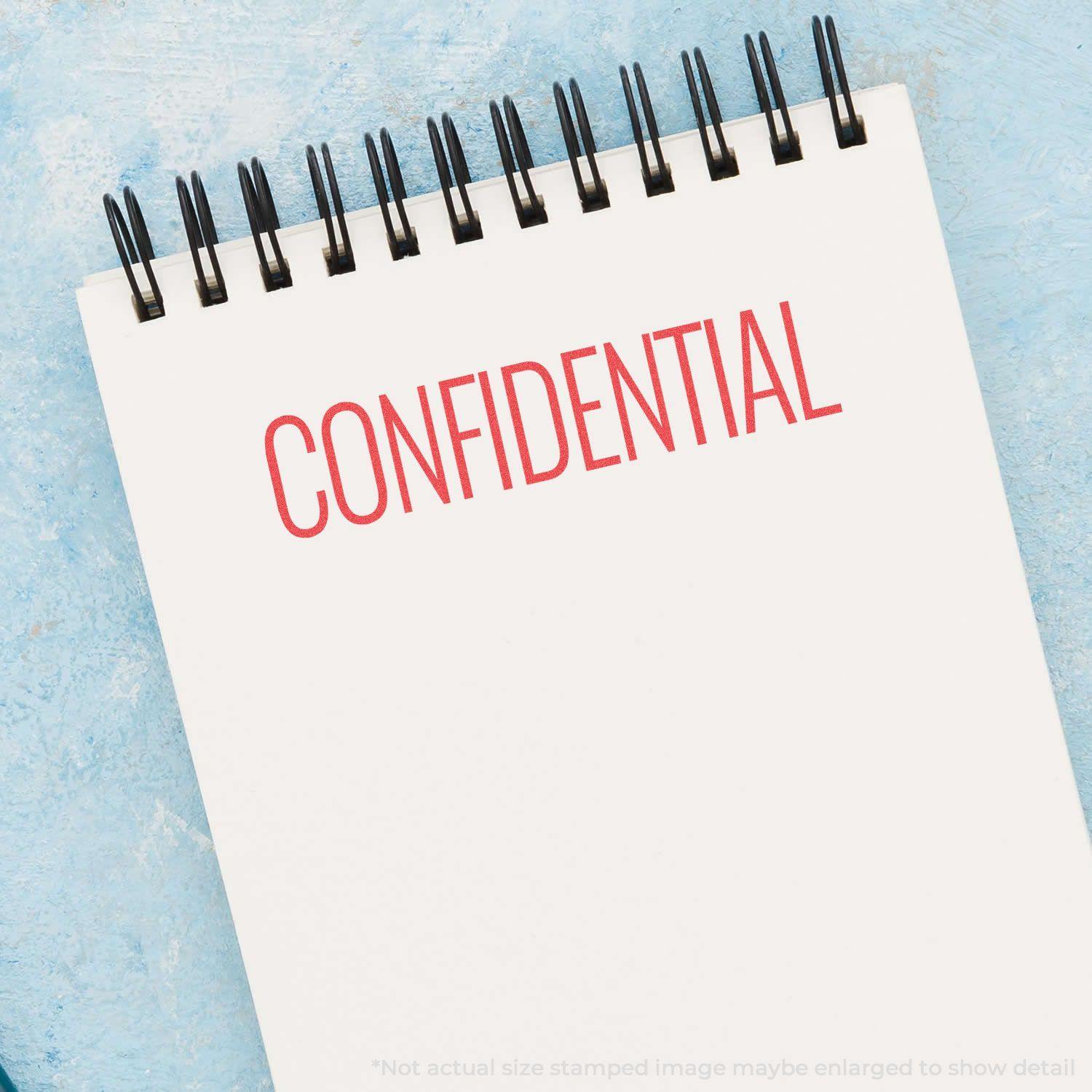 Red Confidential Xstamper Stamp In Use