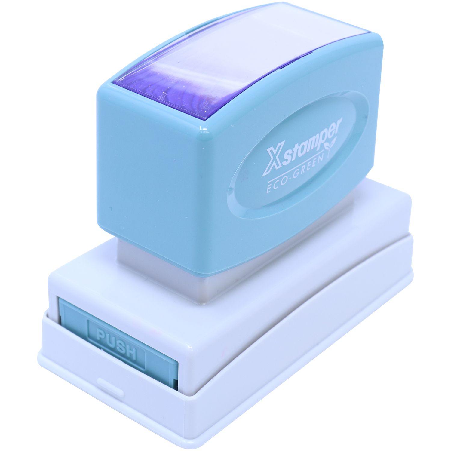 Jumbo Dated Material Open Immediately Xstamper Stamp in blue and white, shown at an angle with the Xstamper logo visible on the side.